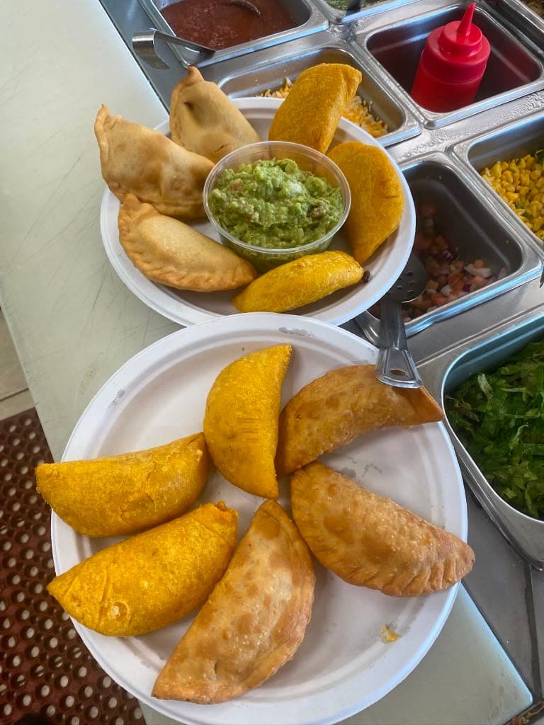 Fried empanadas served with guacamole