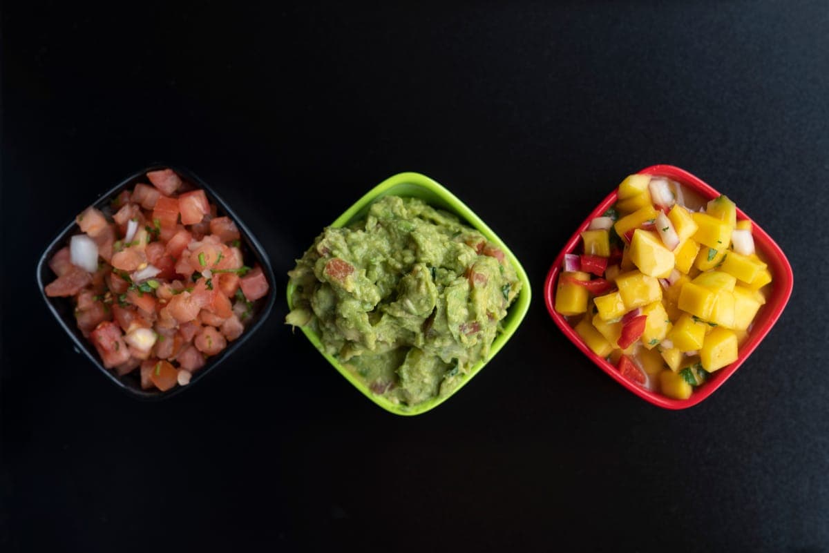 Fresh guacamole, pico de gallo and mango salsa