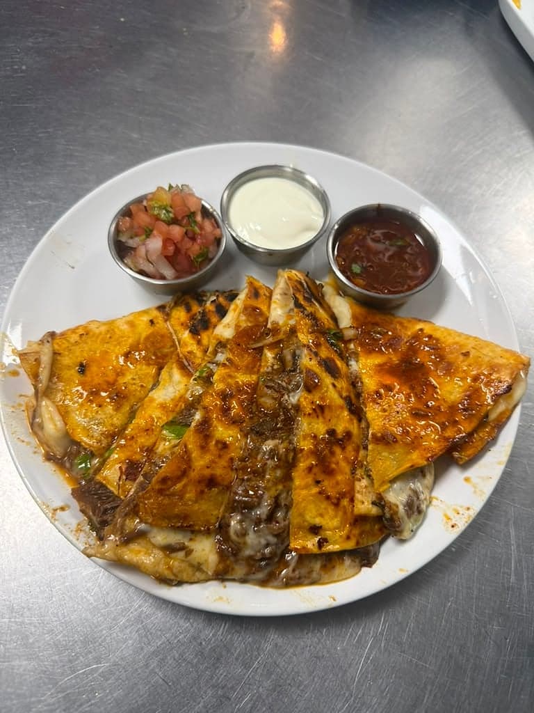 Grilled steak quesadillas with pico de gallo, sour cream and salsa